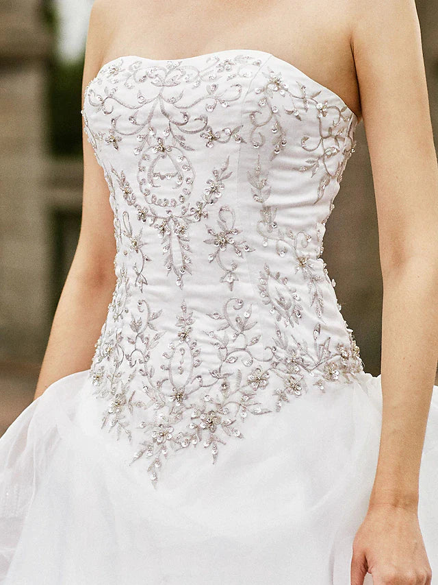 Detailed view of the organza fabric and layered skirt design.