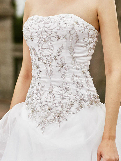 Detailed view of the organza fabric and layered skirt design.
