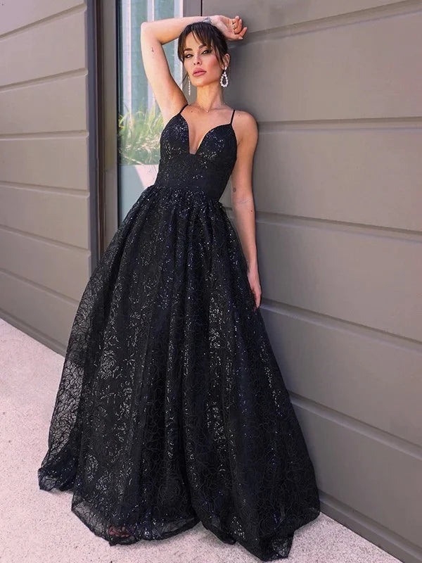 Full view of a shimmering blue A-line sequin prom dress with a V-neckline.