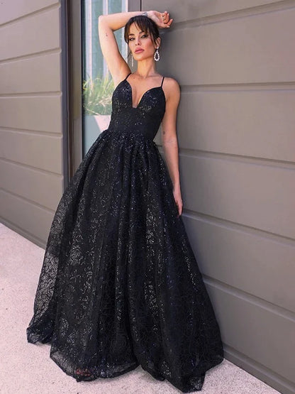 Full view of a shimmering blue A-line sequin prom dress with a V-neckline.