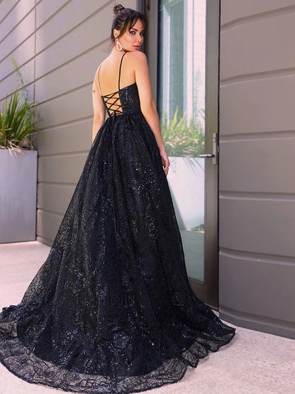 Side view of the blue sequin prom dress, highlighting the sparkling fabric.