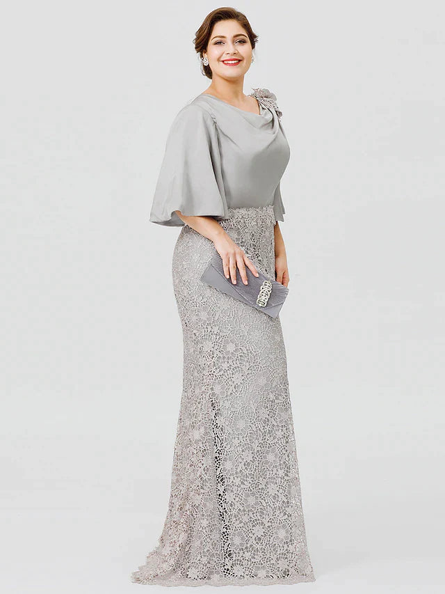 Cowl neck and half sleeve detail of a satin lace dress.