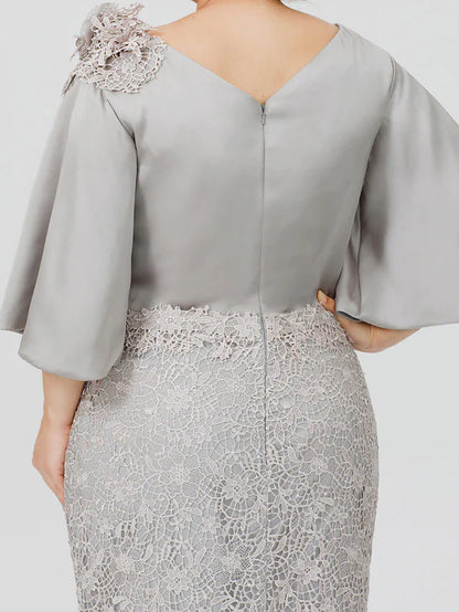 Close-up of lace appliques on the bodice of a satin dress.