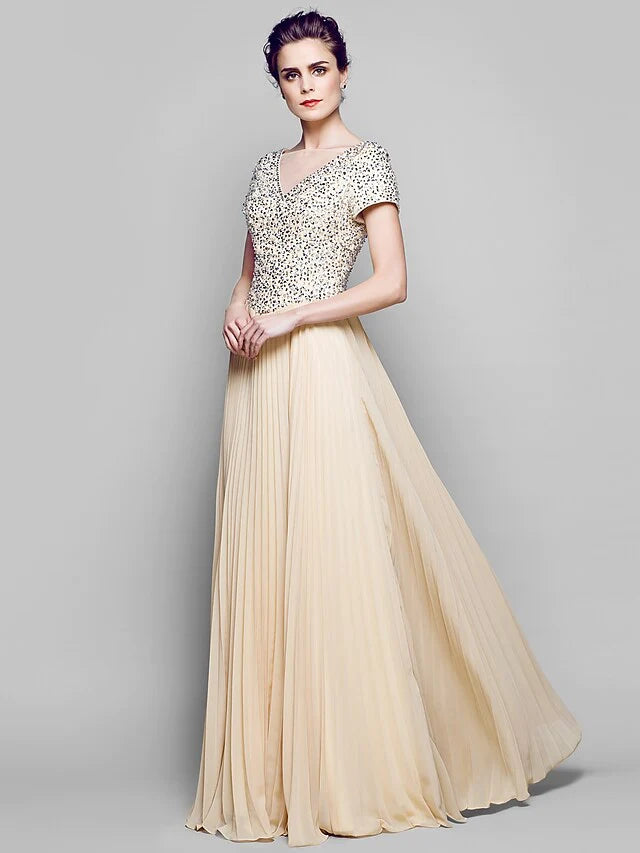 Close-up of the shimmering sequined chiffon and tulle fabric on the Mother of the Bride dress.
