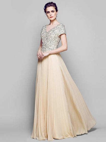 Close-up of the shimmering sequined chiffon and tulle fabric on the Mother of the Bride dress.