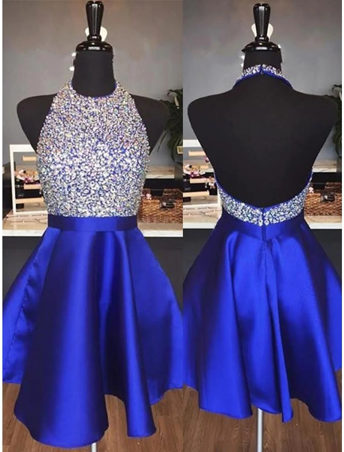 Woman wearing a sparkling A-line halter mini dress with sequin details.