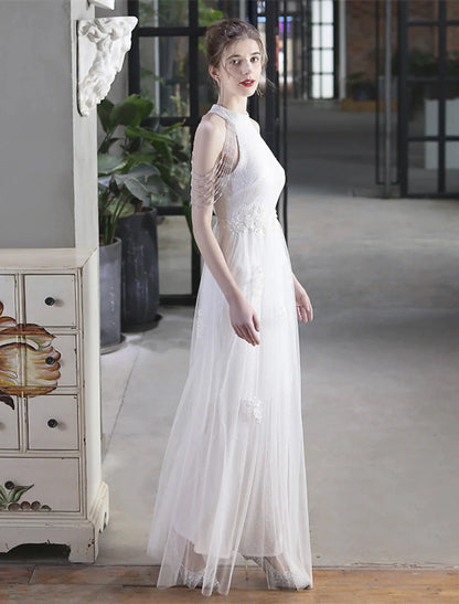 Model walking, showcasing the flow of the floor-length A-line prom dress.