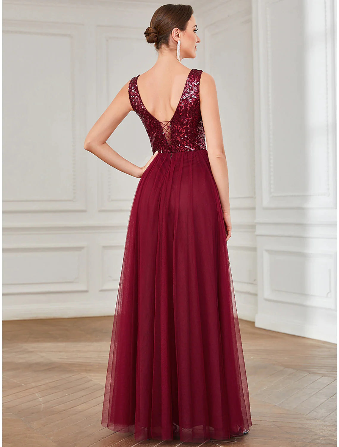 Back view of the elegant sleeveless A-line sequin dress.