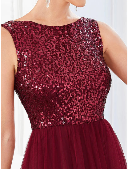 Side profile of the floor-length sequin tulle party dress.