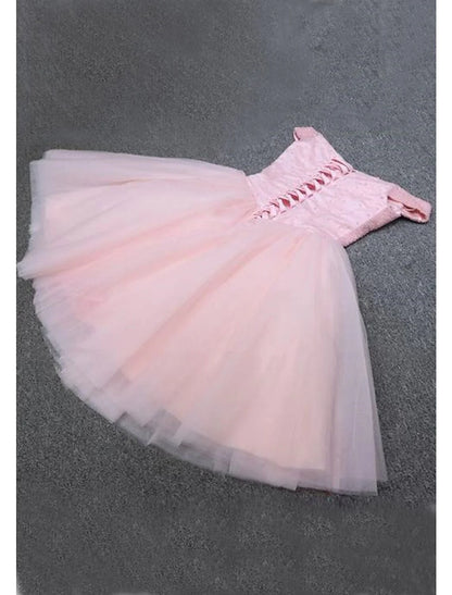 Back view of a woman in a sequined tulle A-Line off-shoulder party dress.