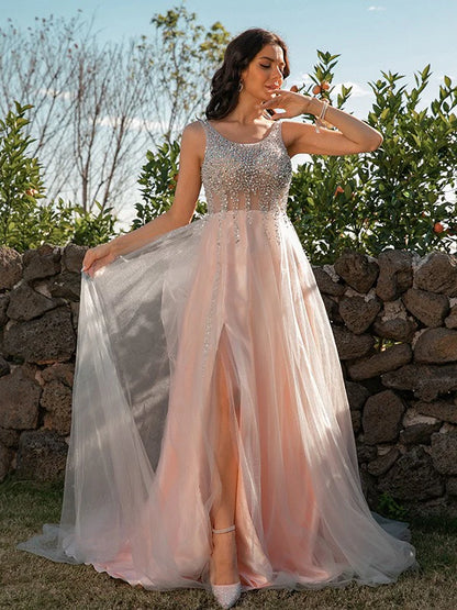 Full view of a sparkling A-Line Princess prom dress with sequin straps and tulle skirt.