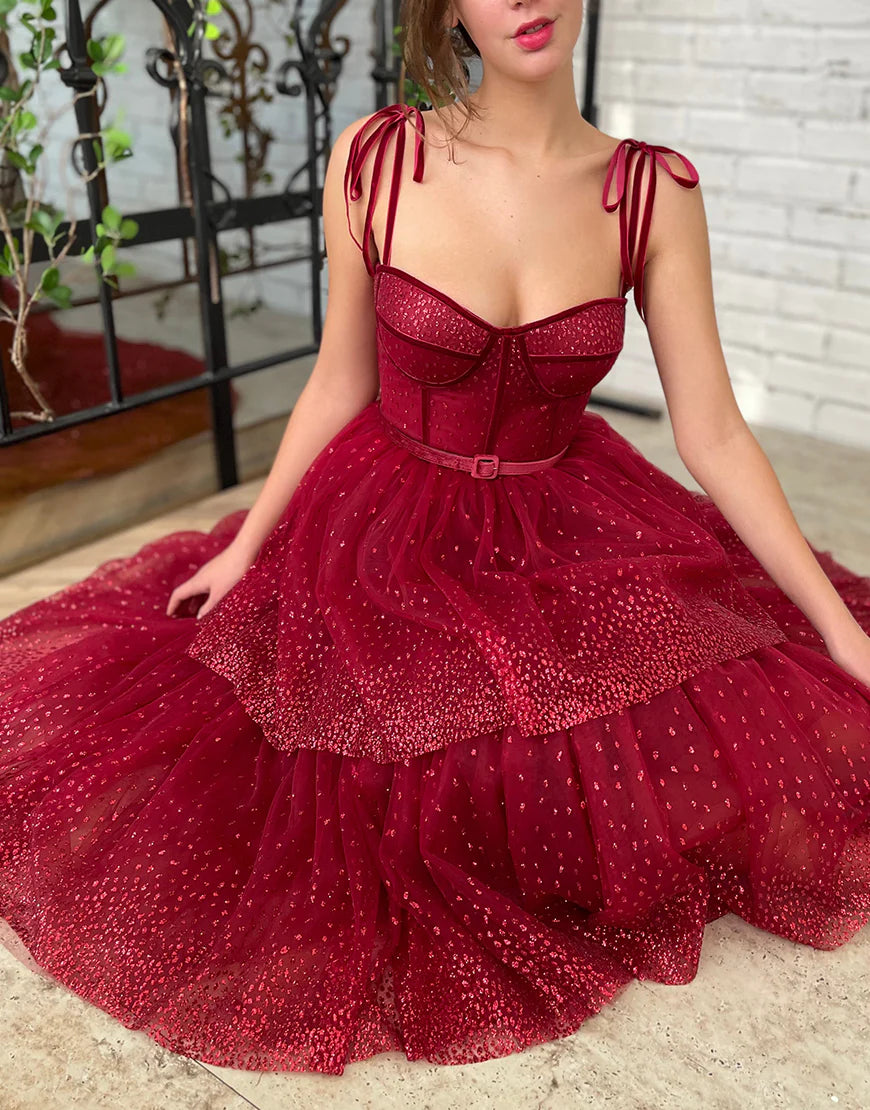 Back view of the A-line tulle tea length dress with delicate straps.
