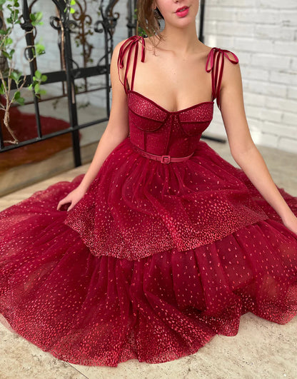 Back view of the A-line tulle tea length dress with delicate straps.