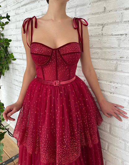 Model posing in the flowing A-line tulle homecoming dress.