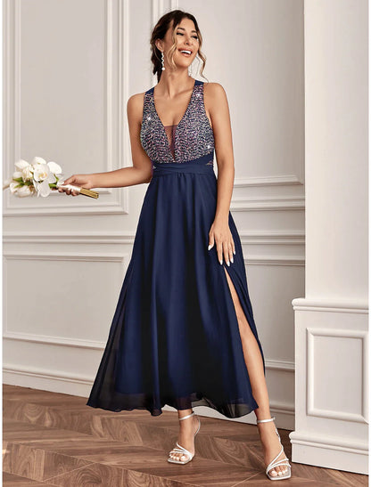 Model wearing a sparkling A-line sequined ankle-length V-neck dress with a slit.