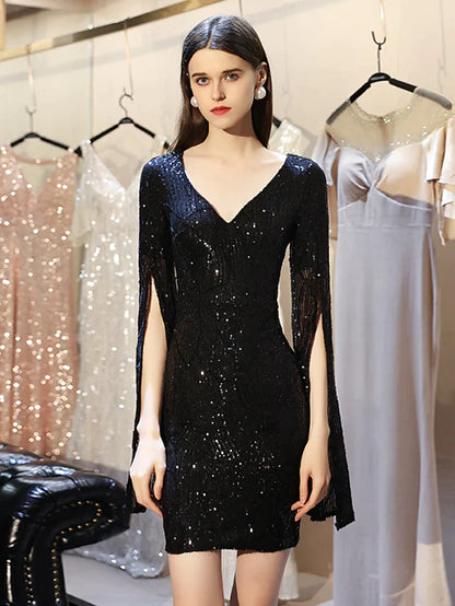 Woman in a sequined mini dress, showcasing the short length and split.