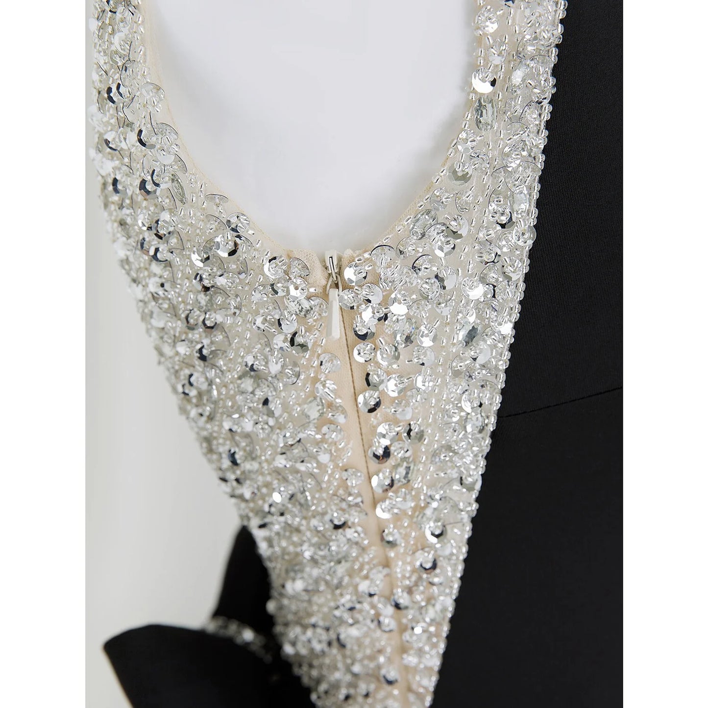 Model wearing the sparkling sleeveless formal evening dress.