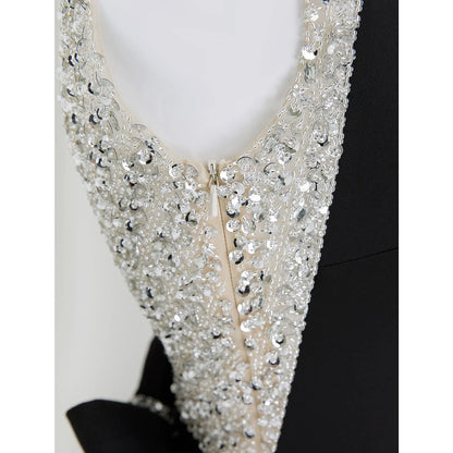 Model wearing the sparkling sleeveless formal evening dress.