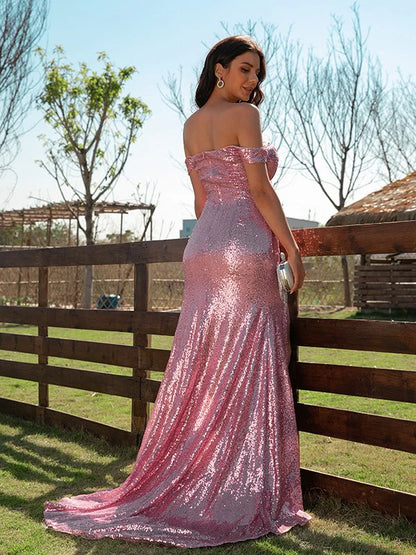 Side view of the elegant sequin off-the-shoulder gown with ruffle details.