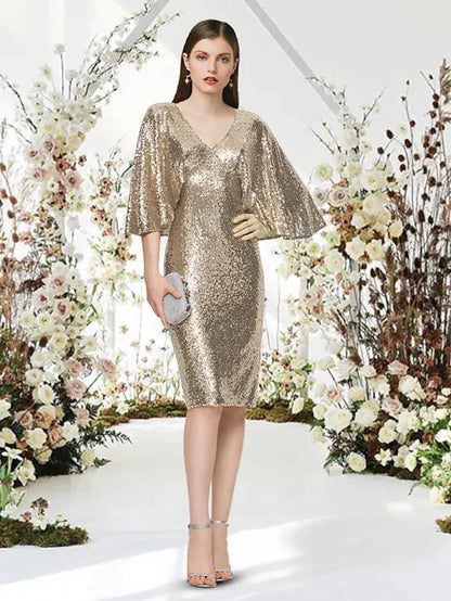 Woman wearing a sparkling silver sequin V-neck half-sleeve knee-length cocktail dress.