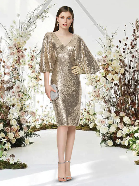 Woman wearing a sparkling silver sequin V-neck half-sleeve knee-length cocktail dress.