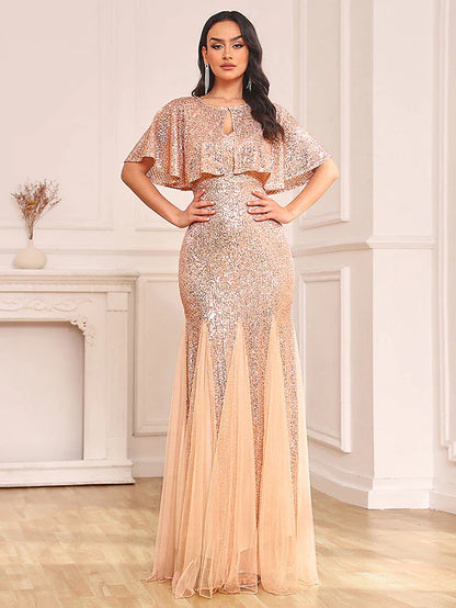 Close-up of sequin shawl and V-neck top of the sparkling two-piece dress.