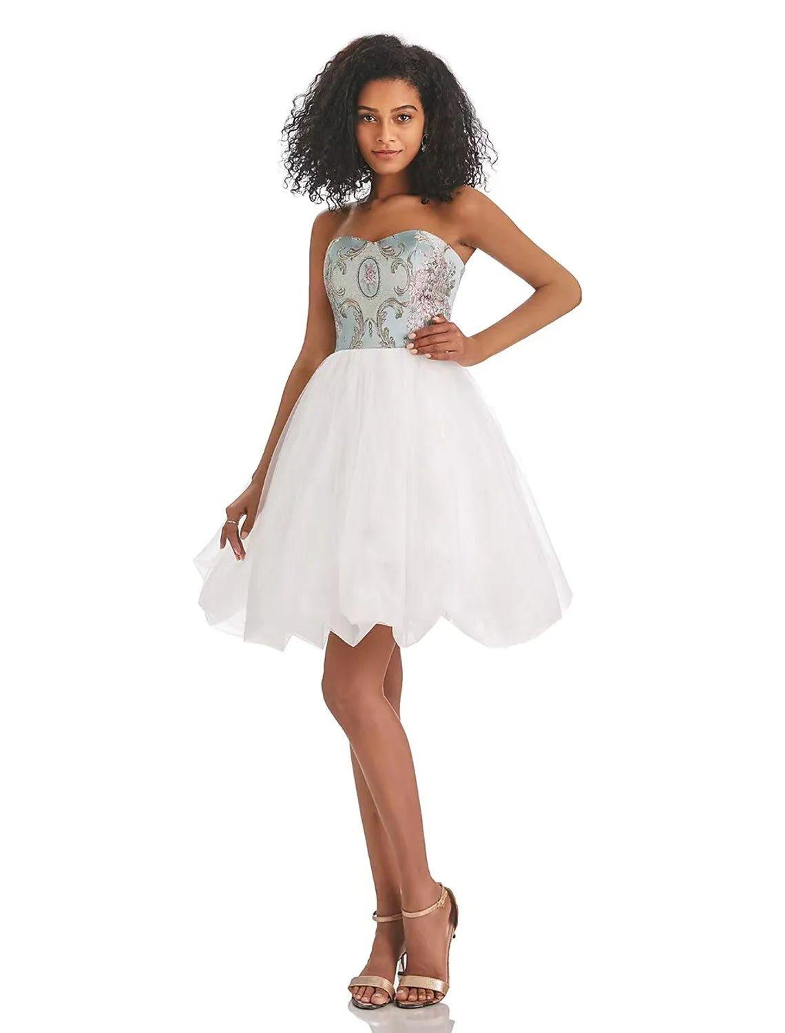 A woman posing in a vibrant A-line strapless color block tulle print short dress.
