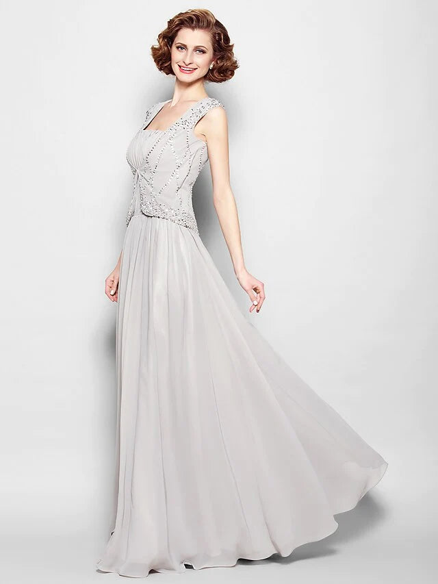 Close-up of the square neckline and delicate beading on the gown.