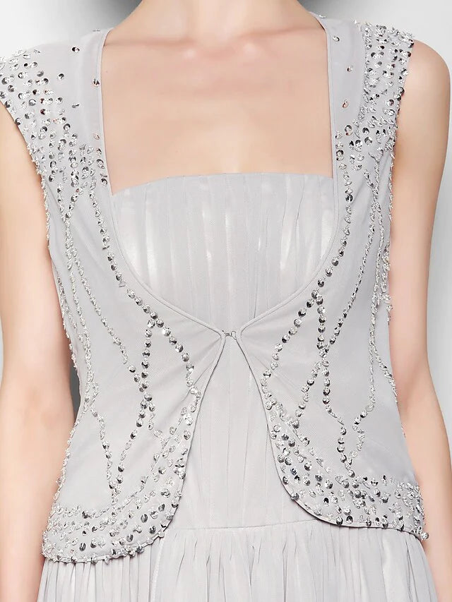 Detail of the flowing chiffon fabric and graceful draping.