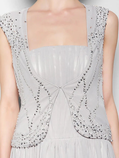Detail of the flowing chiffon fabric and graceful draping.