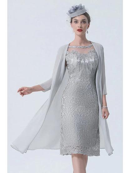 Woman wearing a two-piece mother of the bride dress with jewel neck and 3/4 sleeves.