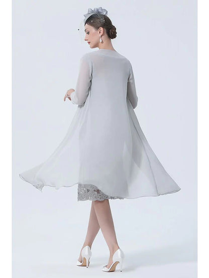 Side view of the two-piece chiffon and lace mother of the bride dress.