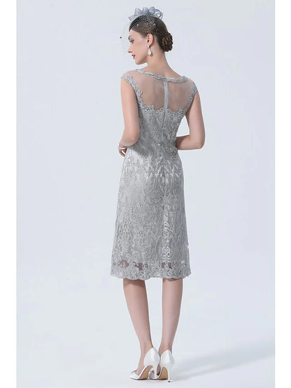 Close-up of the lace detail on the 3/4 sleeve of the dress.